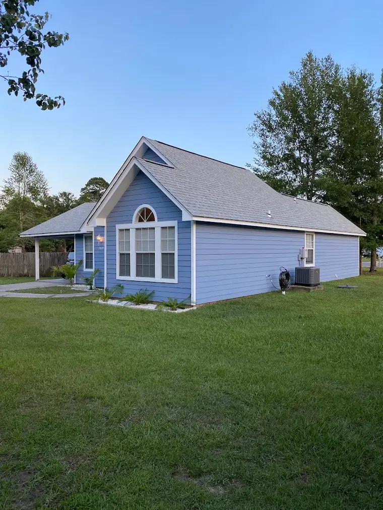 Blue cottage with a new roof