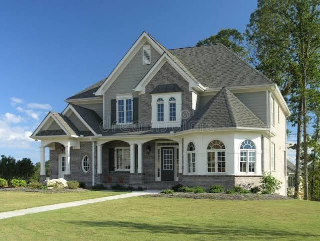 Gray two story home with a new roof