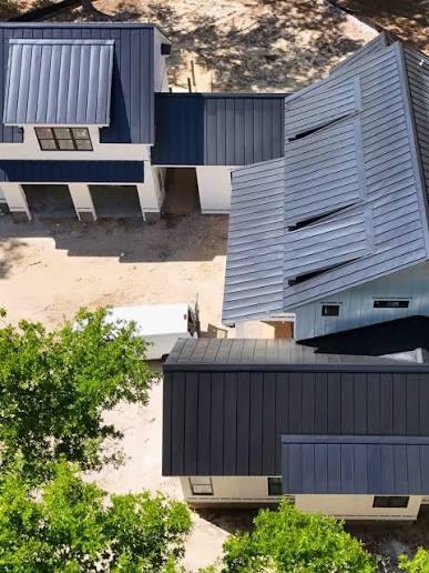 Dark metal roof and cladding on a modern building